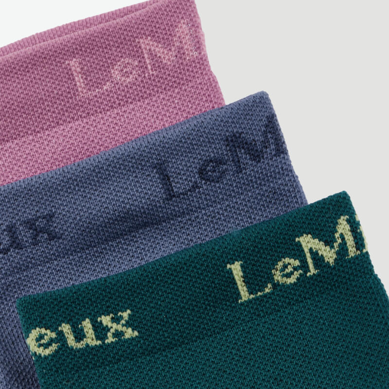 LeMieux Trainer Sock Multi 3pk: blue, green, pink socks with LeMieux on the cuff.