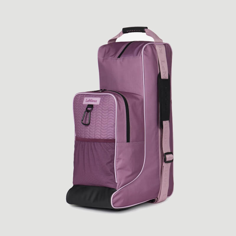 Purple and pink LeMieux Boot & Hat Bag Mallow with handle, front pocket, and shoulder strap.