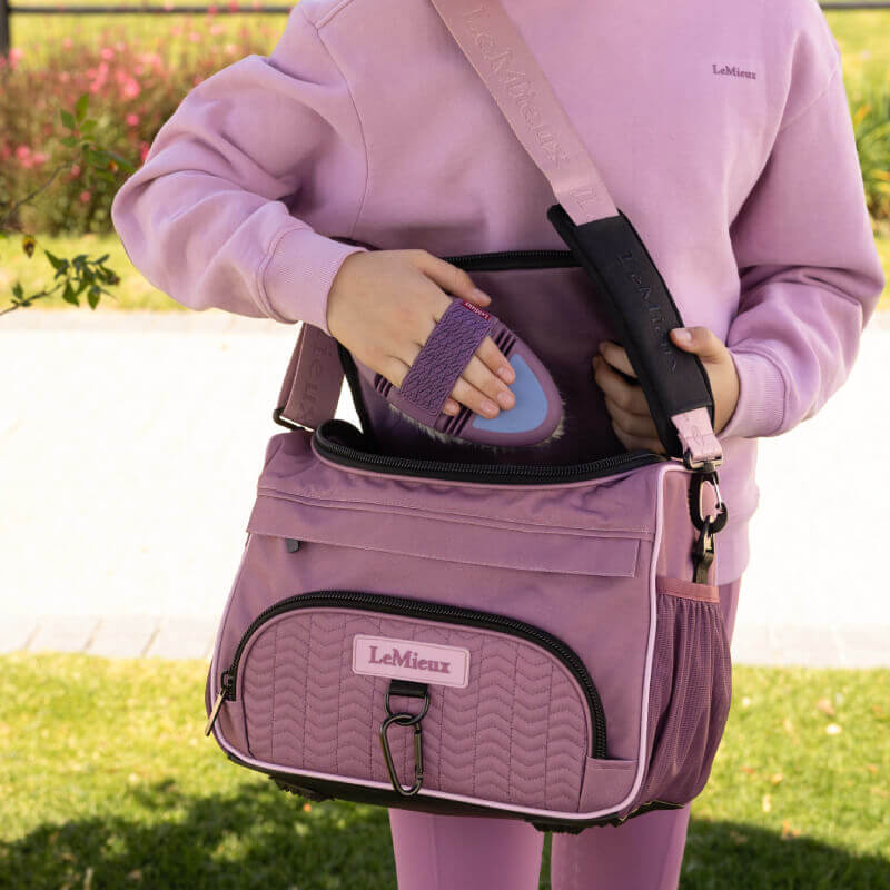 LeMieux ProKit Lite Mallow: lightweight purple bag with handle, front pocket & shoulder strap.