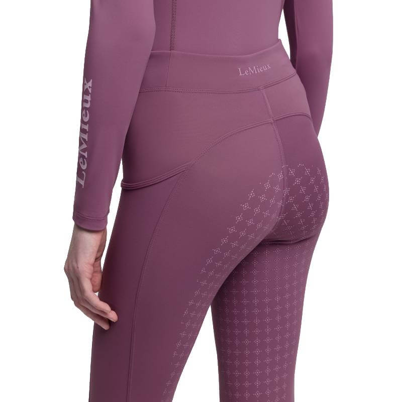 Young rider in LeMieux Orla Pull On Breech Mallow, shown from back and side.