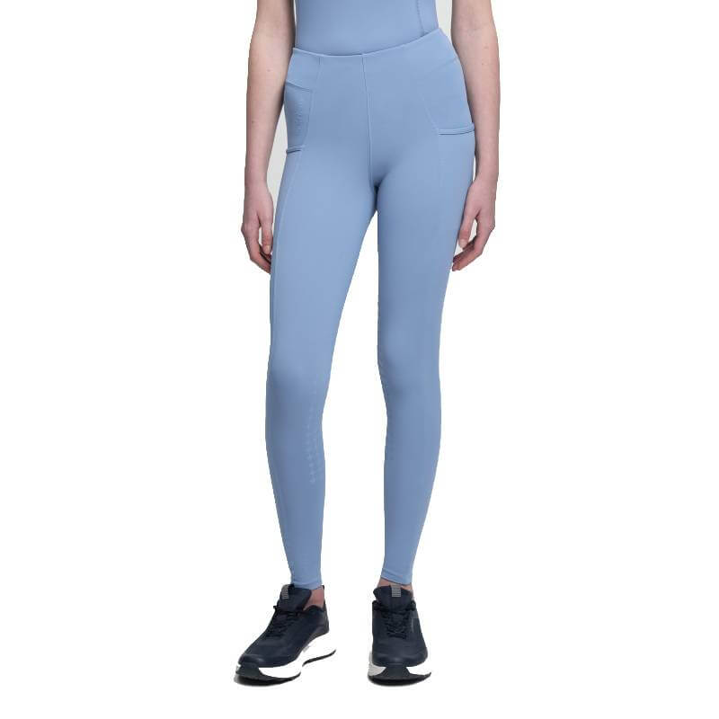 Person wears LeMieux Young Rider Orla Pull On Breech Powder Blue with black sneakers on white.