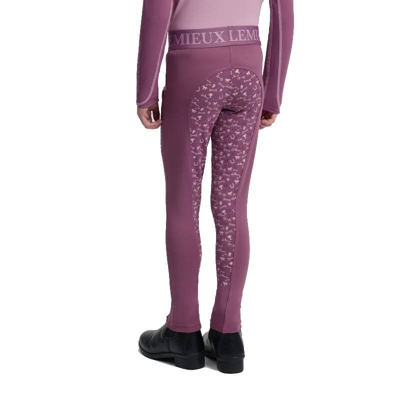 Person in LeMieux Mini Pull On Breech Mallow leggings, upright, back view.