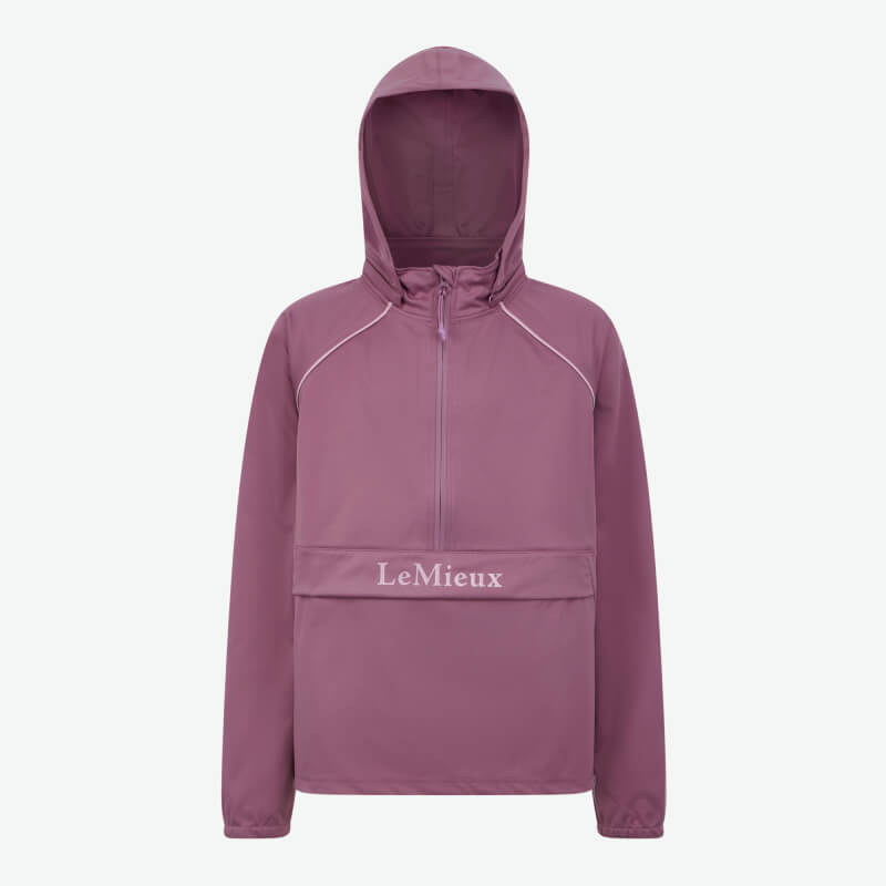Person in a LeMieux Young Rider Paige Quarter Zip Waterproof Jacket Mallow, on white background.