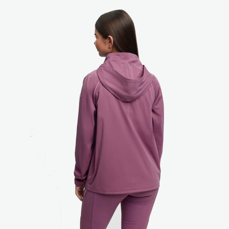 Woman in LeMieux Paige Quarter Zip Waterproof Jacket Mallow, back to camera.