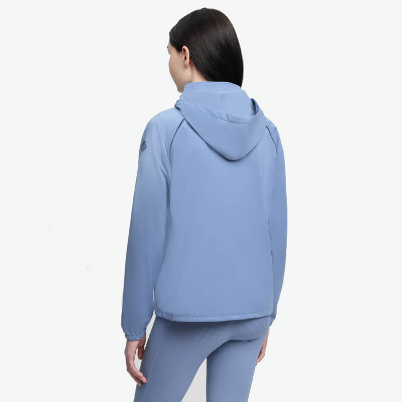 Person in LeMieux Paige Quarter Zip Waterproof Jacket in Powder Blue, back to camera.