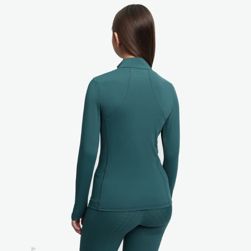 Person in LeMieux Young Rider Classique Baselayer Jungle, facing away to show the back.