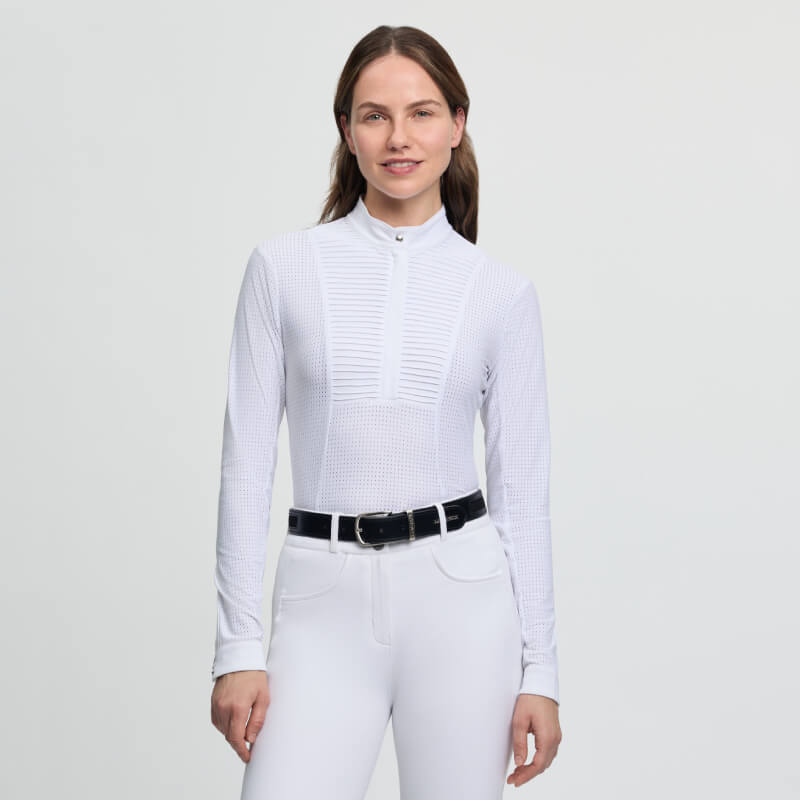 Woman in a LeMieux Arielle Long Sleeve Show Shirt White stands against a plain background.