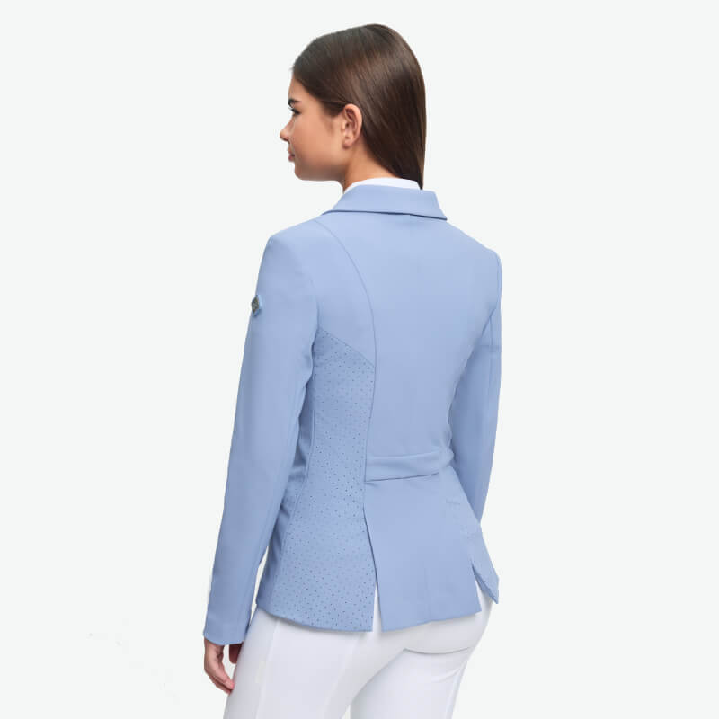 Woman wears LeMieux Young Rider Kennedy Show Jacket in Powder Blue, back to camera.