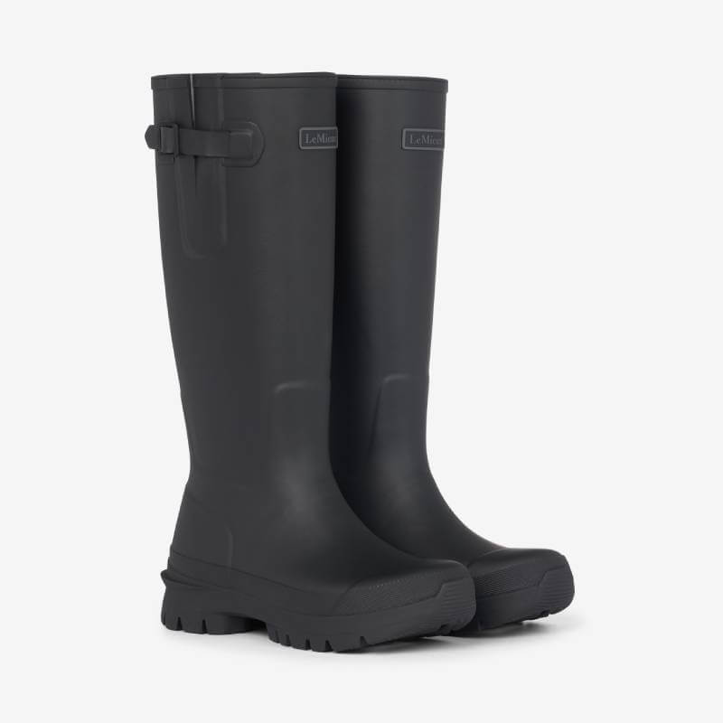 LeMieux Bramshaw Welly Black: Tall black waterproof boots with side buckles on white background.
