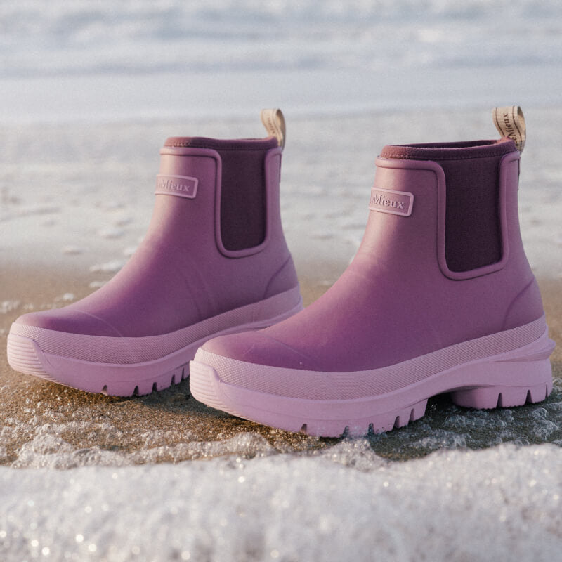 LeMieux Bramshaw Chelsea Welly Mallow boots with neoprene lining by the water, sunlight shining.