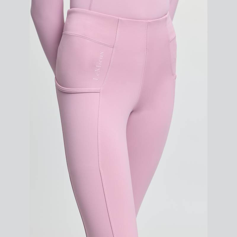 LeMieux Orla Pull On Breech Fondant: high-waisted, pink, side pockets, full seat grip.