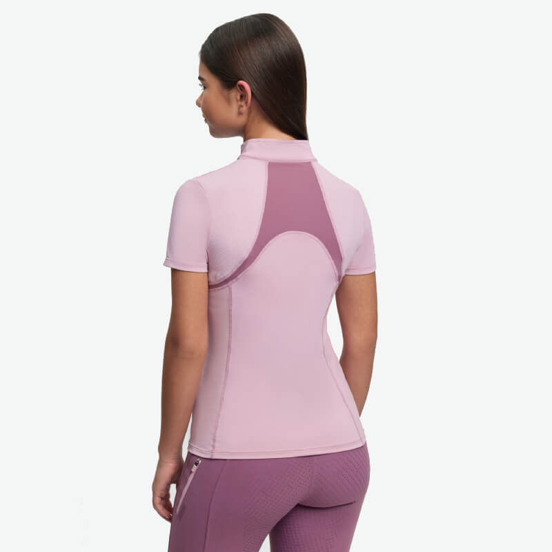 Girl in LeMieux Young Rider Mia Mesh Baselayer Fondant, back view on white background.