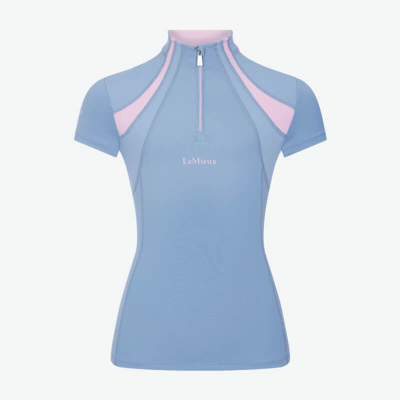 Woman in LeMieux Young Rider Mia Mesh Baselayer Powder Blue, against a white background.