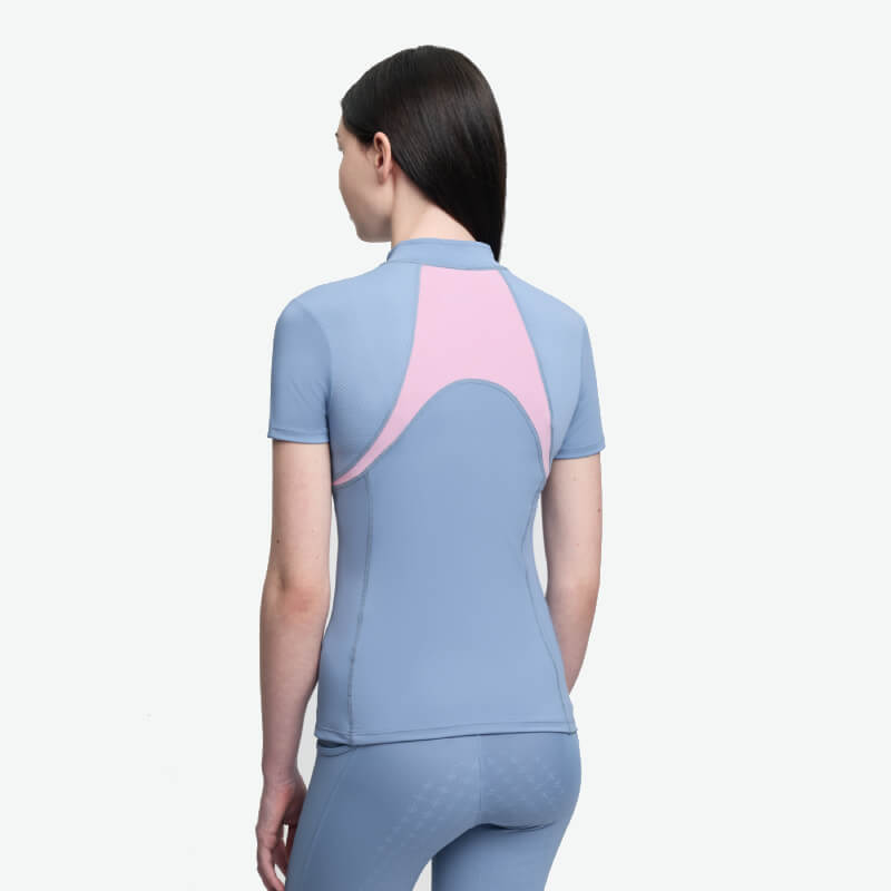 Person in a LeMieux Young Rider Mia Mesh Baselayer Powder Blue, shown from the back on white.