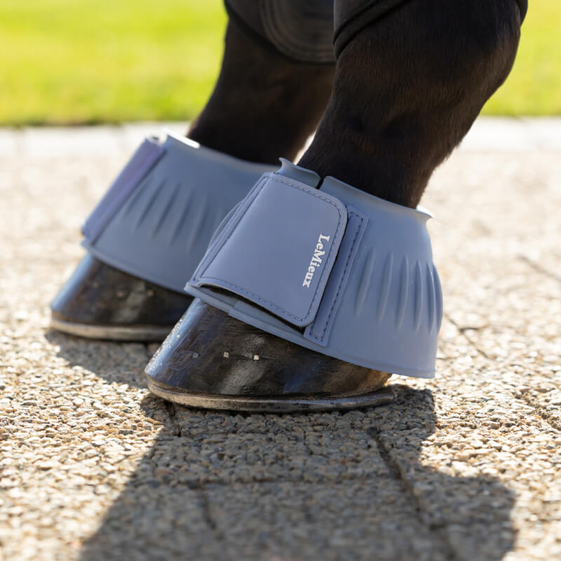 LeMieux Rubber Bell Boots Powder Blue—overreach protection with easy velcro straps.