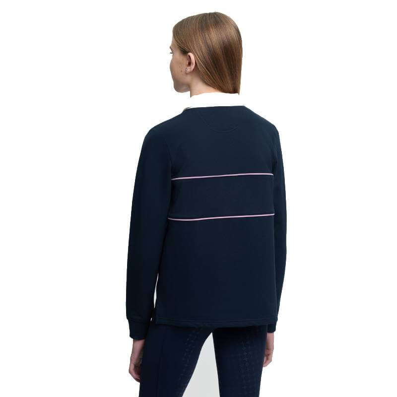 Person with straight light brown hair in LeMieux Young Rider Riley Rugby Shirt Navy, back view.