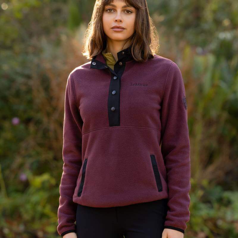LeMieux Piper Popper Fleece Bramble pullover in maroon with black buttons on white background.
