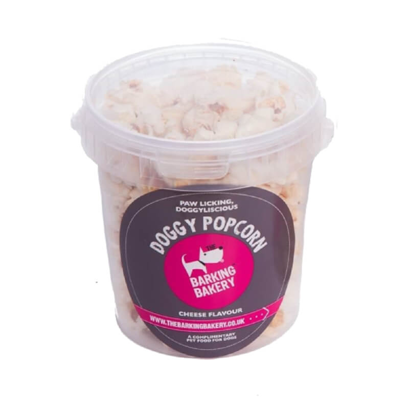 Barking Bakery Doggy Cheesy Popcorn Tub 55g, a cheesy dog snack in a clear plastic tub.