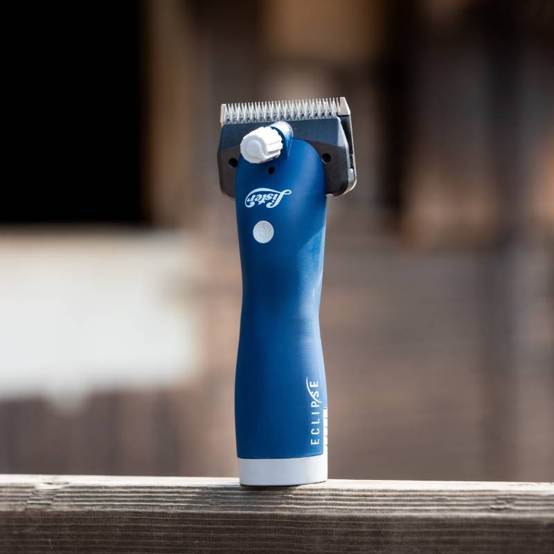 Lister Eclipse 2.0 Clippers Promo Kit by Lister on a wooden surface with a blurred background.