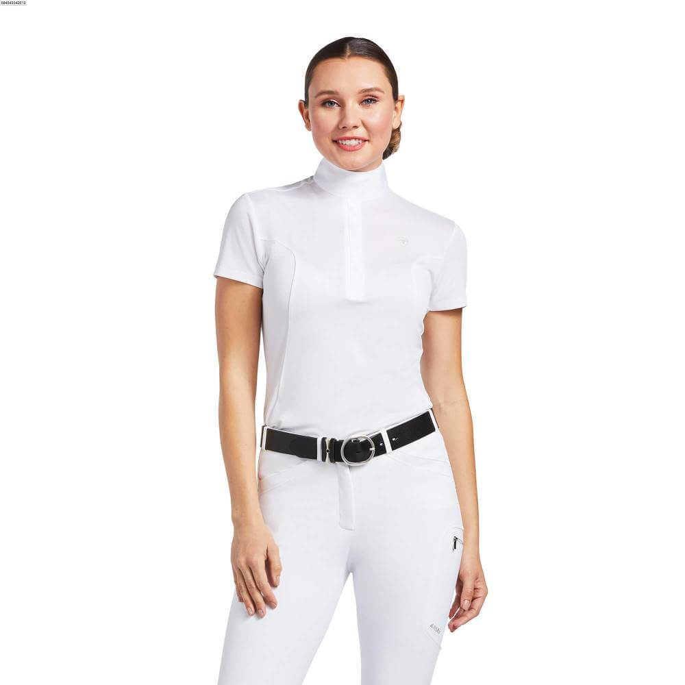 Smiling woman in an Ariat Aptos Show Top White with a black belt.