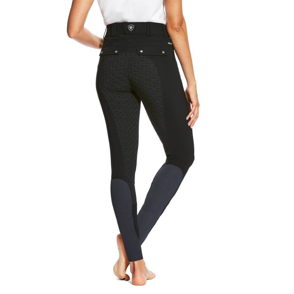 Woman in Ariat Tri Factor Grip Full Seat Black breech, barefoot, facing away from camera.