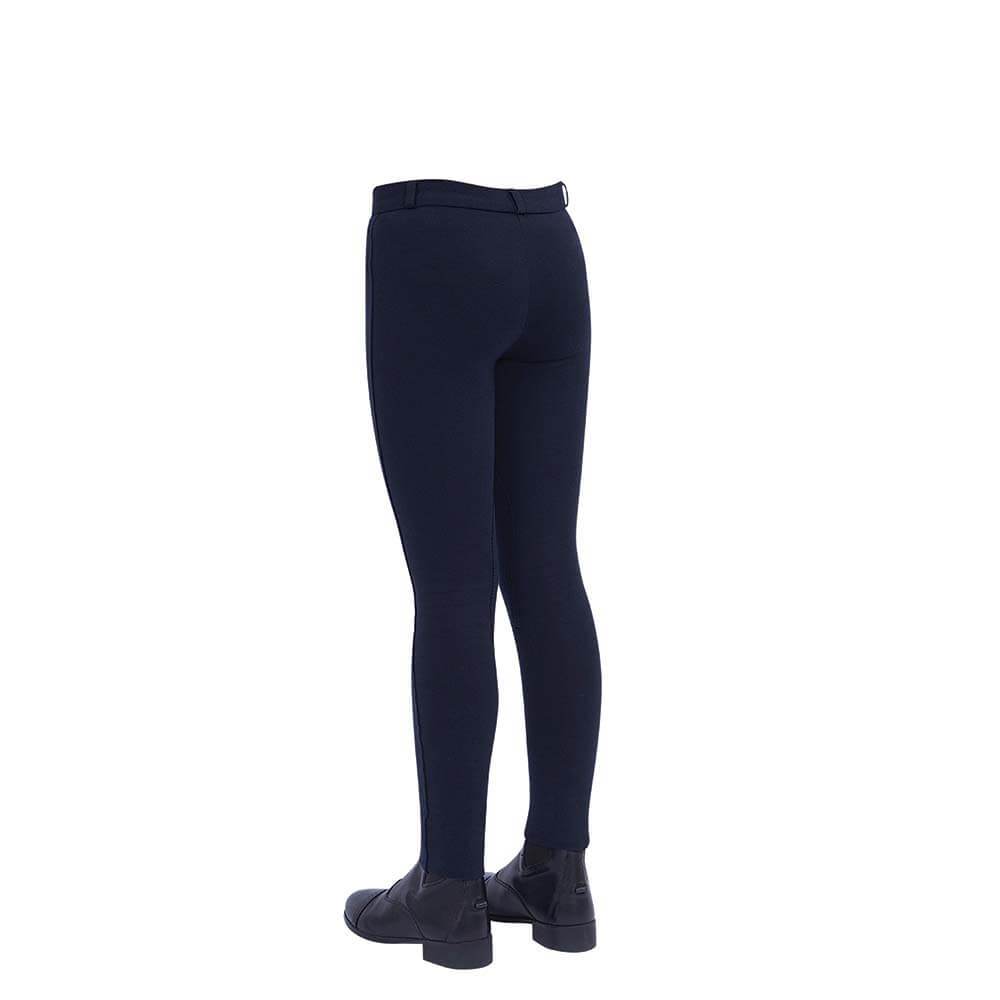 Child wearing Dublin Supa-Fit Zip-Up Knee Patch Jodhpurs, navy, seen from the back with black boots.