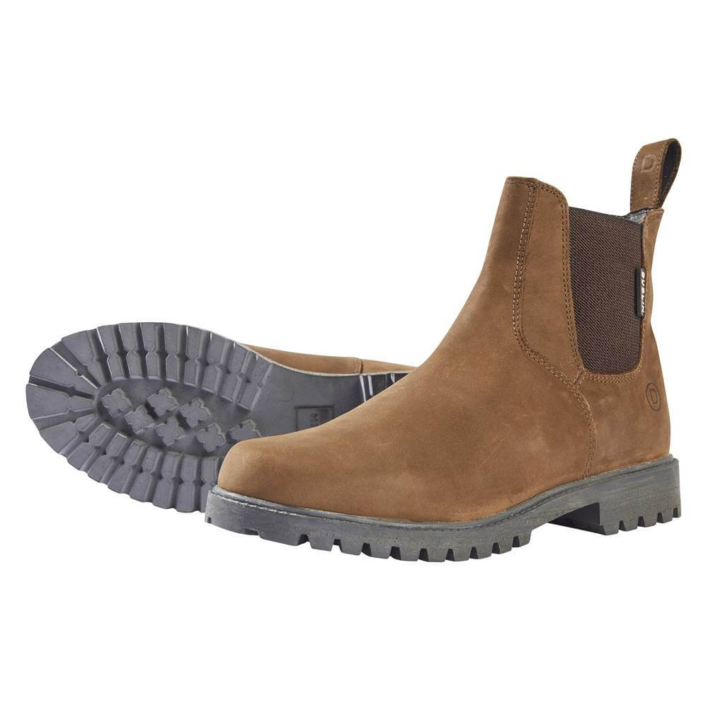 Dublin Venturer III boots in brown waxy leather with black chunky soles; one upright, one on its side.