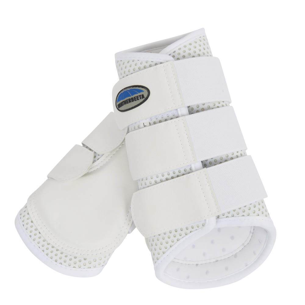 Close-up of a horse’s legs in Weatherbeeta Exercise Boots on a sandy surface.