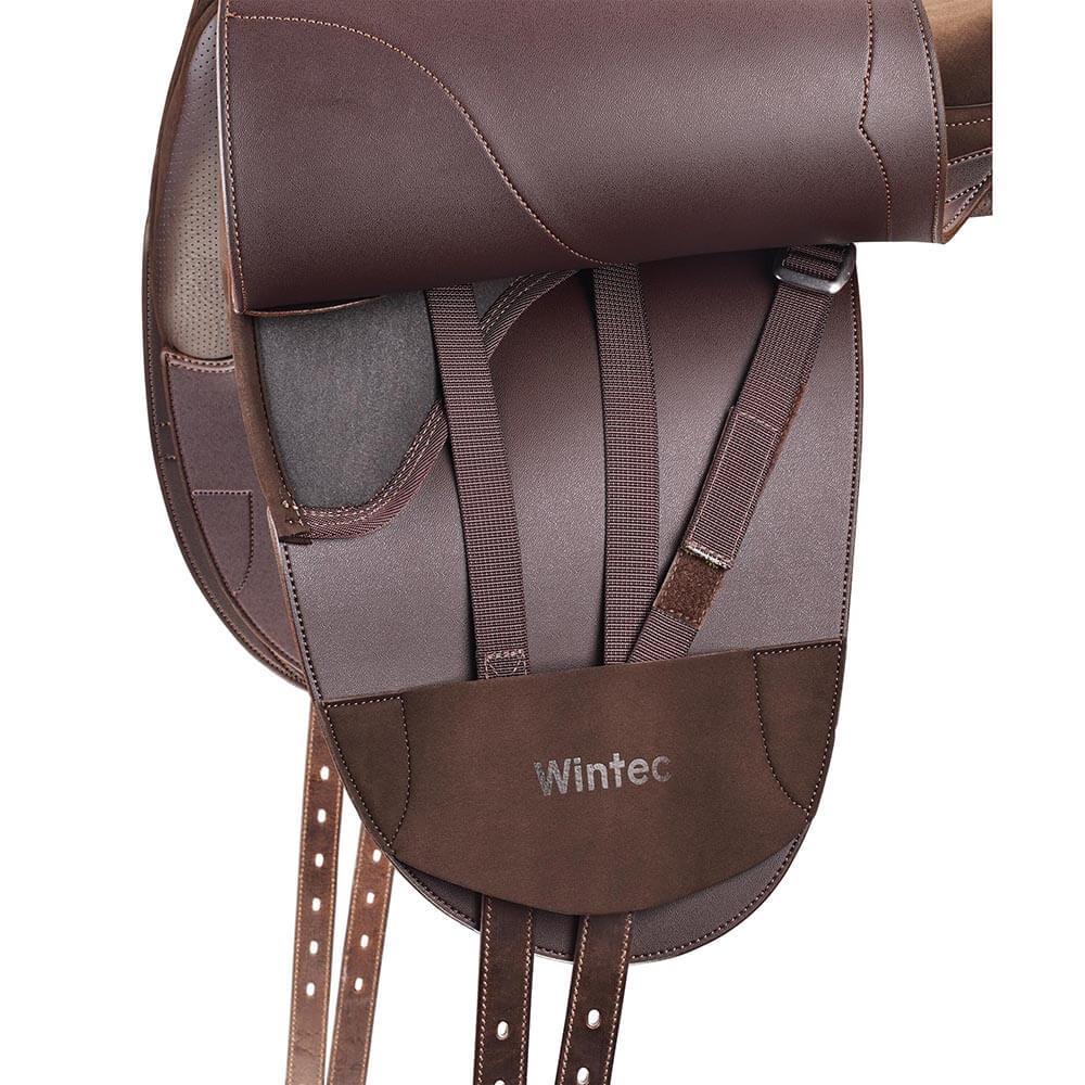Close-up of a brown Wintec Pro Stock Hart Saddle with visible straps and stitching details.