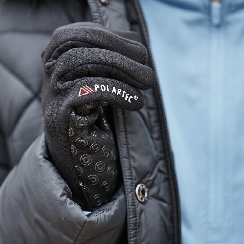 Wearing Dublin Polartec Fleece Riding Gloves in black and a light blue jacket.