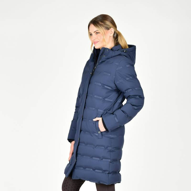 Woman wearing the Weatherbeeta Helsinki Heat Seal Quilted Jacket in Navy Iris, standing sideways.