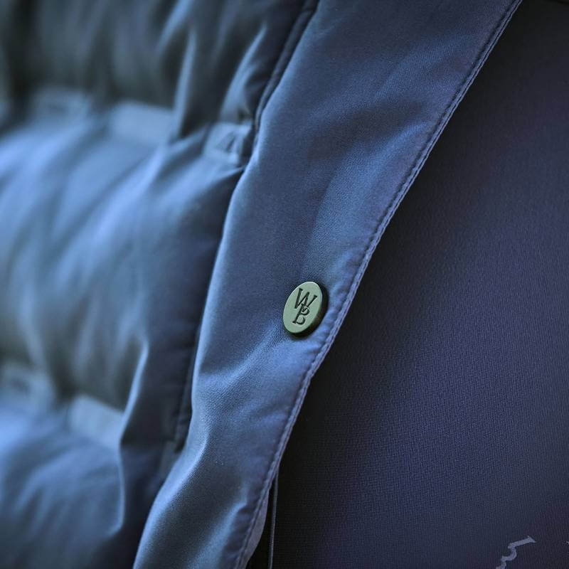 Close-up of a button on the Weatherbeeta Helsinki Heat Seal Quilted Jacket in Navy Iris.