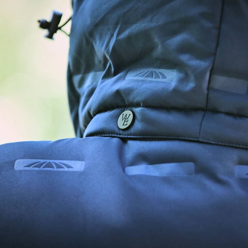 Close-up of Weatherbeeta Helsinki Heat Seal Quilted Jacket Navy Iris with branded button.