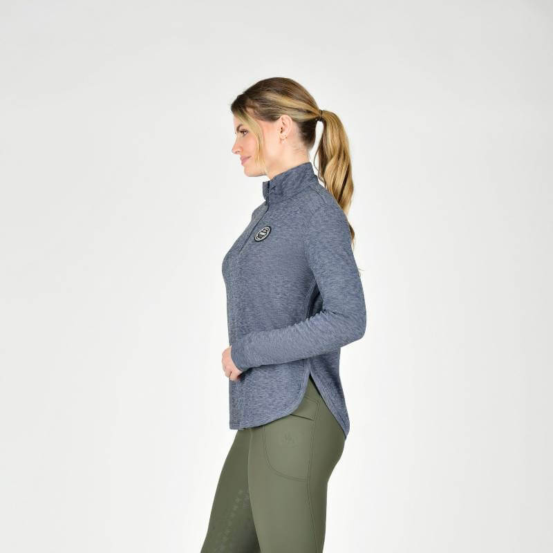 Woman in a Weatherbeeta London Layer Long Sleeve Top Navy Iris stands in profile.