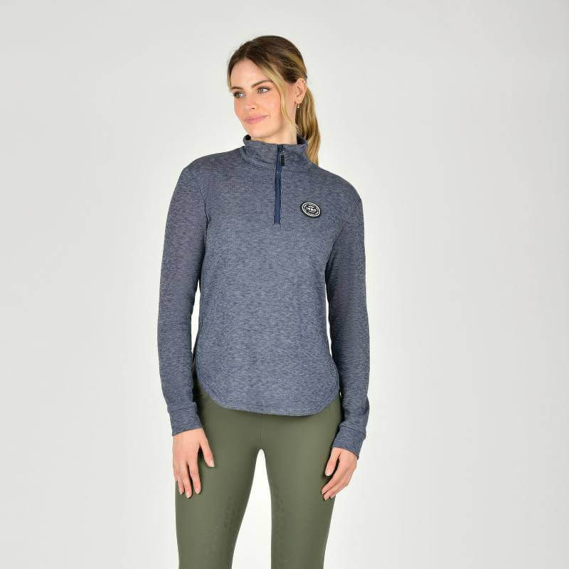 Woman in Weatherbeeta London Layer Long Sleeve Top Navy Iris standing against a plain background.