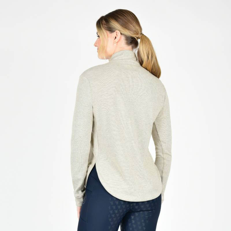 Woman with blonde ponytail in Weatherbeeta London Layer Long Sleeve Top Irish Cream, facing away.