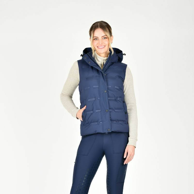 Woman in a Weatherbeeta Hapur Heat Seal Quilted Vest Navy Iris, smiling against a white background.