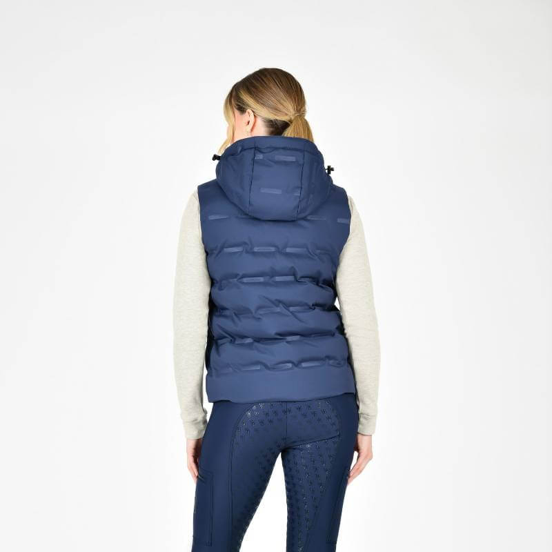 Woman in a Weatherbeeta Hapur Heat Seal Quilted Vest Navy Iris, facing away on white.
