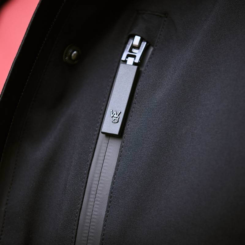 Close-up of Weatherbeeta Kyla II Waterproof Jacket Black zipper with WB logo on the pull tab.