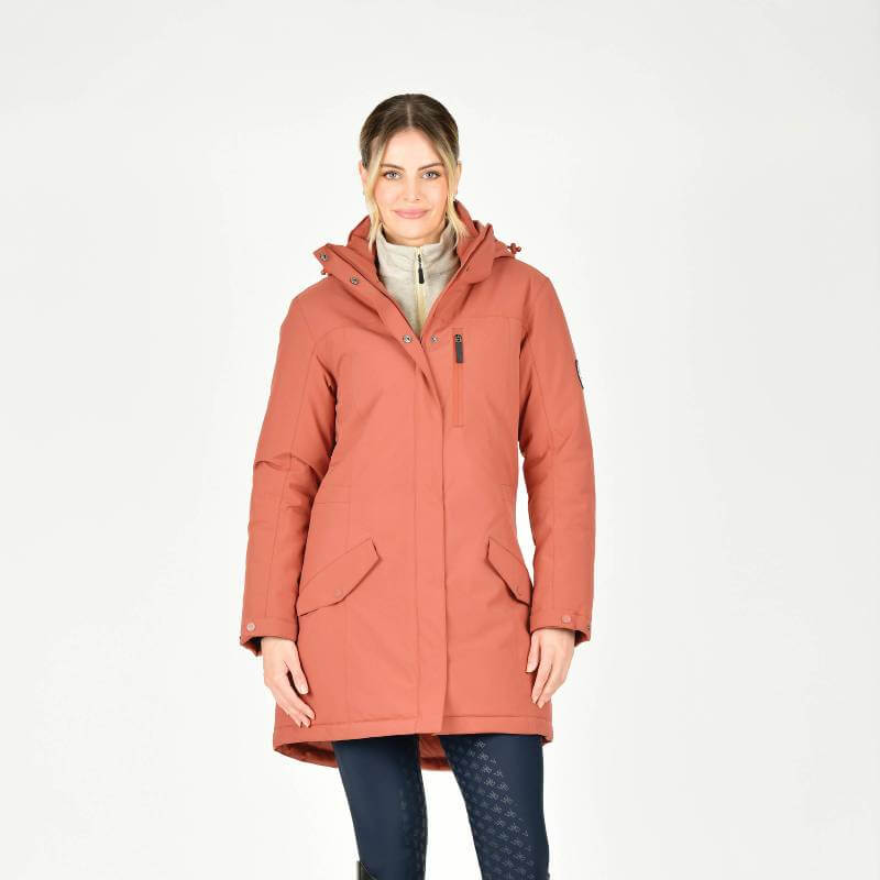 Woman in a Weatherbeeta Kyla II Waterproof Jacket Redwood Ladies, smiling against a white background.