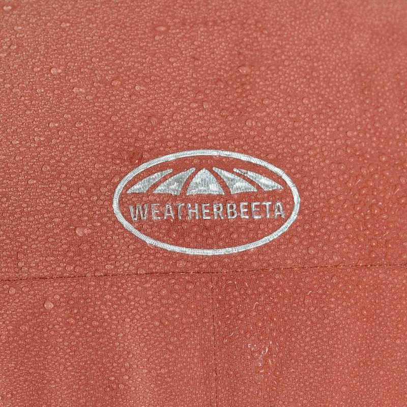 Close-up of wet Weatherbeeta Kyla II Waterproof Jacket Redwood Ladies with water droplets.