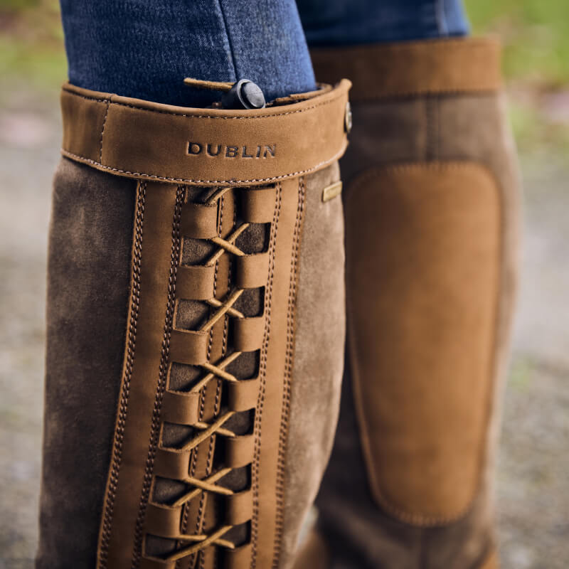 Close-up of Dublin Pinnacle Boots III Dark Brown with side laces, worn with jeans.