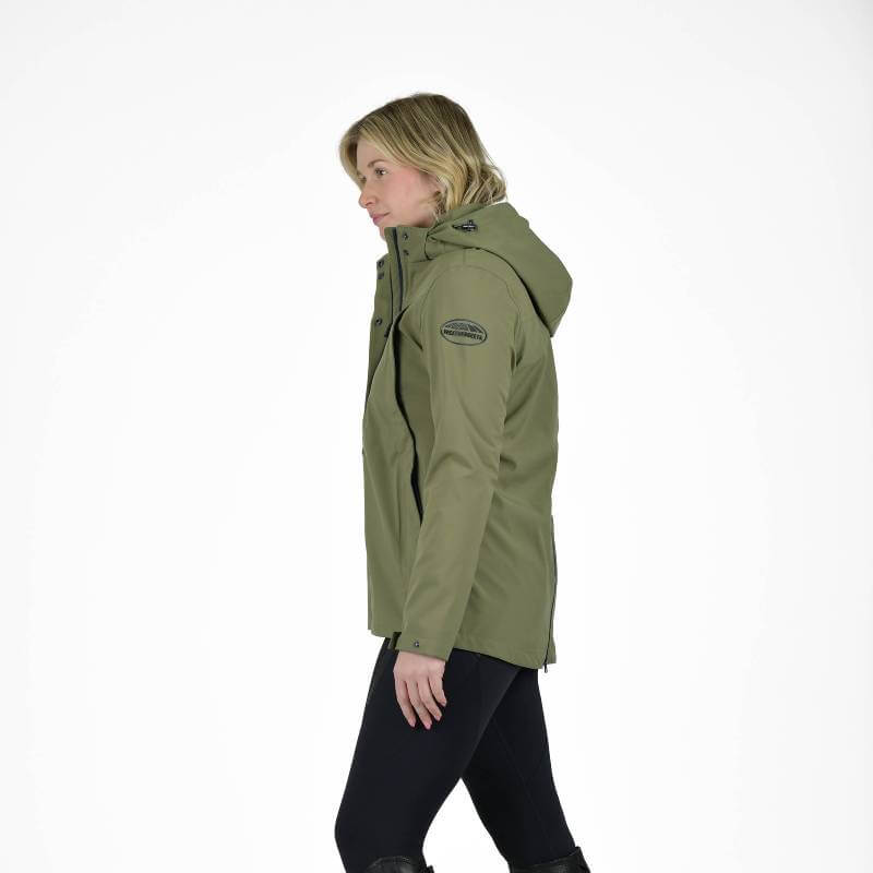 Woman in a Weatherbeeta Florence Fleece Two-For Jacket Olive Night/Black and black pants.