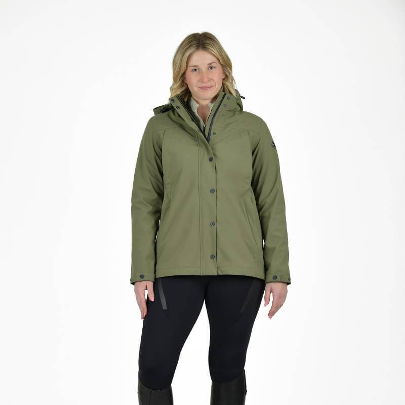 Woman in a Weatherbeeta Florence Fleece Two-For Jacket Olive Night/Black and black pants.