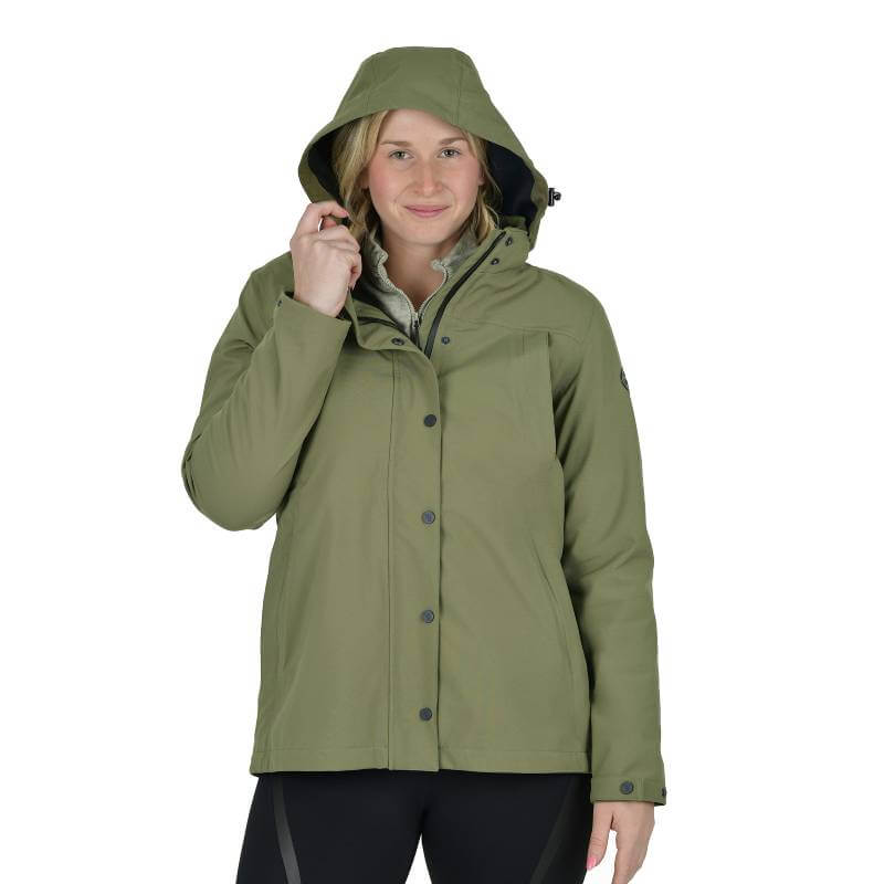 Woman in a Weatherbeeta Florence Fleece Two-For Jacket, Olive Night/Black, smiles at camera.