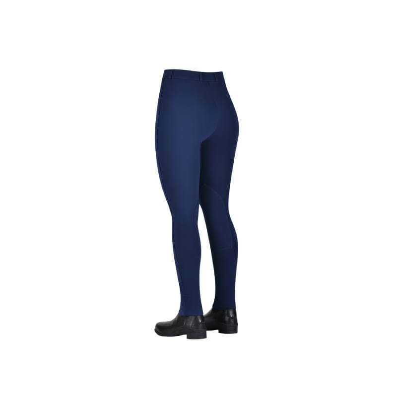 Woman wearing Saxon Warm Up Zip Front Jodhpurs Ladies Navy, shown from the back on white.