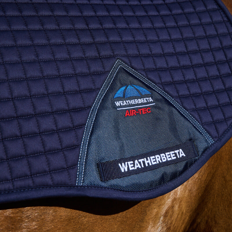 Close-up of a Weatherbeeta Prime Air-Tec All Purpose Saddle Pad Navy on a horse’s back.
