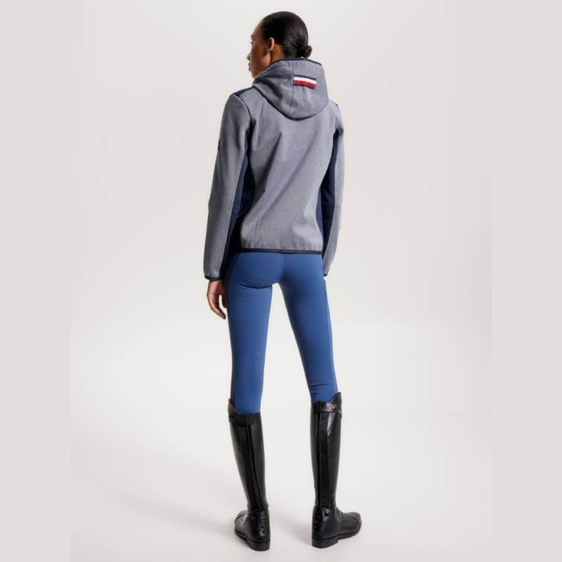 Person in a Tommy Hilfiger London Softshell Jacket Grey Melange, back facing the camera.