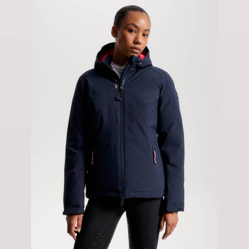 Woman in a Tommy Hilfiger London Winter Riding Jacket Desert Sky against a plain background.