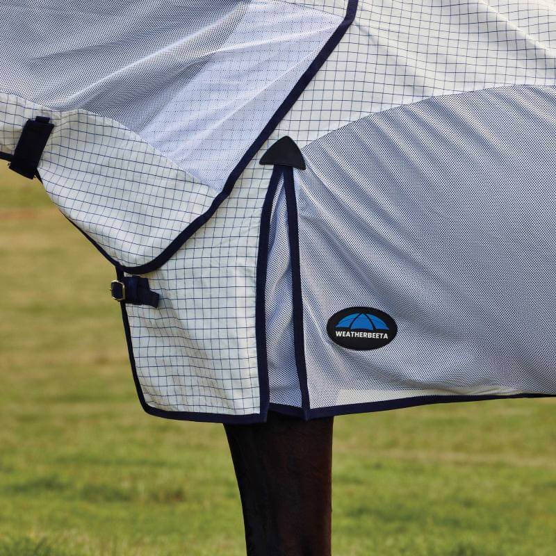 Weatherbeeta Airstream Combo Neck Rug on a horse grazing in a field, White/Navy, UV protection.